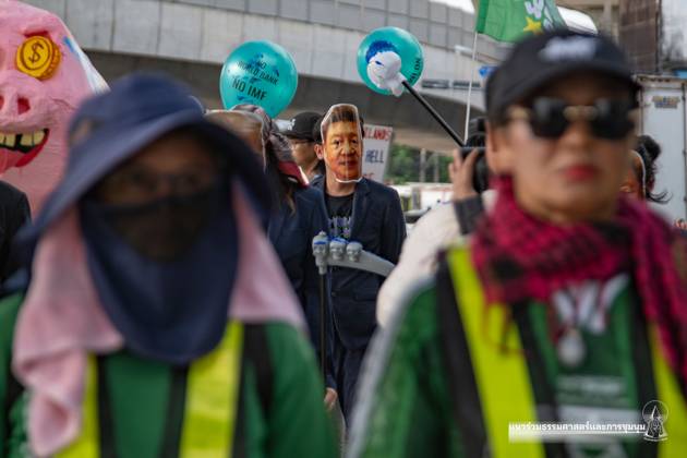 October 15, 2026, Bangkok, Thailand: BANGKOK, THAILAND, OCTOBER 15, 2026: Civil society activists march in Bangkok to protest against the World Bank and the International Monetary Fund during their 2026 Annual Meetings. Demonstrators carry banners and signs opposing the institutions as organisers seek police permission to demonstrate outside the Queen Sirikit National Convention Center. Bangkok Thailand - ZUMAq101 20261015_zna_q101_041 Copyright: xPanawatxSeangsotgx