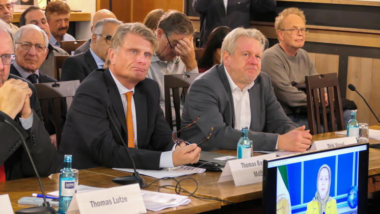 October 14, 2026, Berlin, Germany: German Bundestag Members ,Thomas Bareiß and Dirk Vöpel seen during the conference at the panel table as a video message of Mrs. Maryam Rajavi, the president elect of NCRI is displayed on a monitor . The conference, titled Iran in Crisis: The Democratic Solution and Germany s Responsibility, was organized by the German Solidarity Committee for a Free Iran (DSFI) and the Association of German-Iranians (GDI) at Hopfingerbräu am Brandenburger Tor in Berlin, Germany, on October 14, 2026. The conference brought together German federal lawmakers, former diplomats, and witnesses to discuss human rights, democratic prospects for Iran, and an open letter signed by 80 German dignitaries protesting the Friedrich N - ZUMAs197 20261014_aaa_s197_463 Copyright: xSiavoshxHosseinix