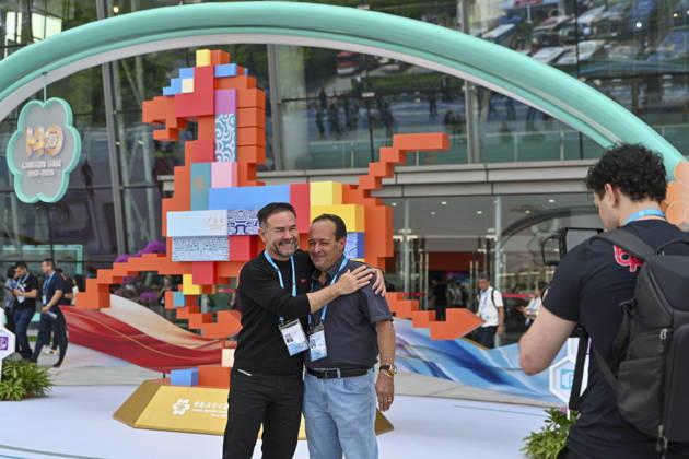 GUANGZHOU, CHINA - OCTOBER 15: Overseas buyers pose for a photo outside the Canton Fair complex during the 140th China Import and Export Fair (Canton Fair) on October 15, 2026 in Guangzhou, Guangdong Province of China. The fair runs in three phases until November 4, covering a total exhibition area of 1.55 million square meters.  Copyright: xChinaxNewsxServicex 111674428732