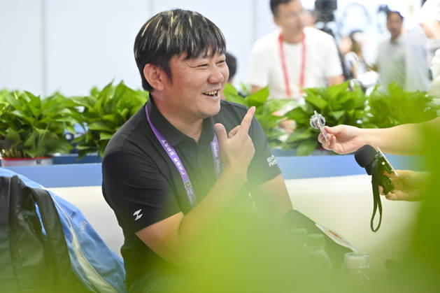 GUANGZHOU, CHINA - OCTOBER 15: Zhang Xue speaks to media at the booth of Chinese motorcycle brand Zhangxue Motorcycle (ZXMOTO) during the 140th China Import and Export Fair (Canton Fair) on October 15, 2026 in Guangzhou, Guangdong Province of China. The fair runs in three phases until November 4, covering a total exhibition area of 1.55 million square meters.  Copyright: xChinaxNewsxServicex 111674432621