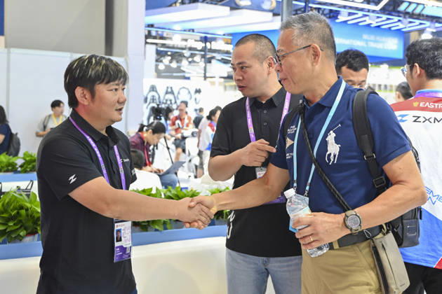 GUANGZHOU, CHINA - OCTOBER 15: Zhang Xue (L) talks with an overseas buyer at the booth of Chinese motorcycle brand Zhangxue Motorcycle (ZXMOTO) during the 140th China Import and Export Fair (Canton Fair) on October 15, 2026 in Guangzhou, Guangdong Province of China. The fair runs in three phases until November 4, covering a total exhibition area of 1.55 million square meters.  Copyright: xChinaxNewsxServicex 111674432509