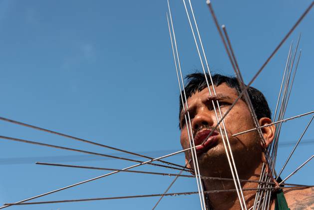 October 15, 2026, Trang, Thailand: A devotee with a skewer piercing his cheek participates in a street procession during the Vegetarian Festival..The annual Vegetarian Festival is held in Bangkok and many parts of southern Thailand, including Trang, Phang Nga, and Phuket, where worshippers refrain from eating animal products over the nine days, coinciding with the celebration of the Nine Emperor Gods. Trang Thailand - ZUMAs197 20261015_aaa_s197_006 Copyright: xPeeraponxBoonyakiatx