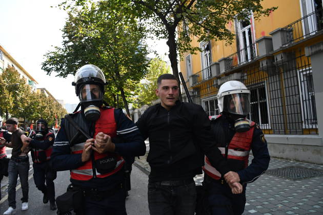 Student protests demanding improved educational conditions continue in Albania TIRANA, ALBANIA - OCTOBER 15: Riot police detain a protester during the third day of demonstrations demanding improved educational conditions in Tirana, Albania, on October 15, 2026. University students are joined by high school students and local residents as tensions escalate, with police using tear gas to disperse demonstrators outside the Ministry of Education and the Parliament building, while protesters throw stones and other objects at police officers. Olsi Shehu Anadolu Tirana Albania. Editorial use only. Please get in touch for any other usage.  Copyright: x2026xAnadoluxOlsixShehux