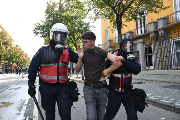 Student protests demanding improved educational conditions continue in Albania TIRANA, ALBANIA - OCTOBER 15: Riot police detain a protester during the third day of demonstrations demanding improved educational conditions in Tirana, Albania, on October 15, 2026. University students are joined by high school students and local residents as tensions escalate, with police using tear gas to disperse demonstrators outside the Ministry of Education and the Parliament building, while protesters throw stones and other objects at police officers. Olsi Shehu Anadolu Tirana Albania. Editorial use only. Please get in touch for any other usage.  Copyright: x2026xAnadoluxOlsixShehux