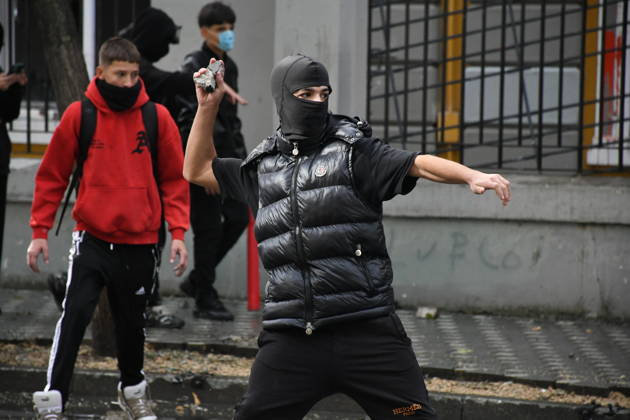 Student protests demanding improved educational conditions continue in Albania TIRANA, ALBANIA - OCTOBER 15: A masked protester prepares to throw a stone during clashes with police on the third day of demonstrations demanding improved educational conditions in Tirana, Albania, on October 15, 2026. University students are joined by high school students and local residents as tensions escalate, with police using tear gas to disperse demonstrators outside the Ministry of Education and the Parliament building, while protesters throw stones and other objects at police officers. Olsi Shehu Anadolu Tirana Albania. Editorial use only. Please get in touch for any other usage.  Copyright: x2026xAnadoluxOlsixShehux