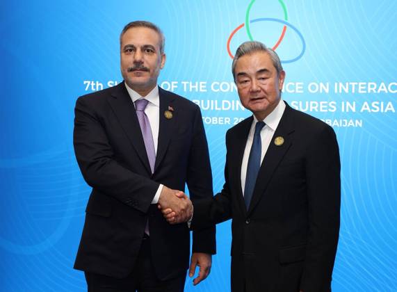 Turkish Foreign Minister Hakan Fidan addresses CICA summit in Baku BAKU, AZERBAIJAN - OCTOBER 15: (----EDITORIAL USE ONLY - MANDATORY CREDIT - ‘TURKISH MINISTRY OF FOREIGN AFFAIRS HANDOUT - NO MARKETING NO ADVERTISING CAMPAIGNS - DISTRIBUTED AS A SERVICE TO CLIENTS----) Turkish Foreign Minister Hakan Fidan (L) meets with Chinese Foreign Minister Wang Yi (R) on the sidelines of the 7th CICA Summit in Baku, Azerbaijan, on October 15, 2026. Turkish Foreign Ministry Handout Anadolu Baku Azerbaijan. Editorial use only. Please get in touch for any other usage.  Copyright: x2026xAnadoluxTurkishxForeignxMinistry Handoutx