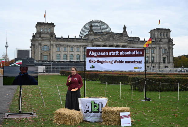 Rally calls for dairy cow pasture subsidy in Berlin BERLIN, GERMANY – OCTOBER 15: People protest in front of the German Bundestag for the introduction of a planned eco-scheme to support pasture-based dairy farming, in Berlin, Germany, 15 October 2026. The Bundestag is scheduled to debate a draft bill that would scrap the proposed subsidy. The protest is part of a week of action highlighting the importance of pasture-based livestock farming. Volodymyr Sindieiev Anadolu Berlin Germany. Editorial use only. Please get in touch for any other usage.  Copyright: x2026xAnadoluxVolodymyrxSindieievx