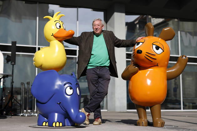 Host Christoph Biemann at the ceremonial unveiling of the new sculpture group featuring a mouse, Elephant, and Duck. The mouse figure had recently been removed. Now it’s clear that it will be joined by an elephant and a duck. Until now, only the mouse stood in front of the WDR building in Cologne. Cologne, October 15, 2026, North Rhine-Westphalia, Germany Copyright: xChristophxHardtx