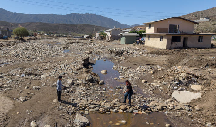 Tropical Storm Rachel leaves deadly flooding and damage in Ensen ENSENADA, MEXICO - OCTOBER 15: Rising river waters triggered by Tropical Storm Rachel flood homes and leave several structures buried under mud and debris in the Lomas de Mendoza community of Ensenada, Baja California, Mexico, on October 15, 2026. The storm damaged roadways and swept away vehicles across the region, claiming at least nine lives while search and rescue teams continue working to locate missing residents. Omar Martinez Anadolu Ensenada Mexico. Editorial use only. Please get in touch for any other usage.  Copyright: x2026xAnadoluxOmarxMartinezx