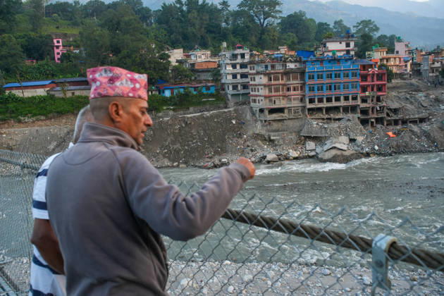 KATHMANDU, NEPAL - OCTOBER 15: Local residents look out from the newly installed Bailey bridge connecting the border areas of Nuwakot and Rasuwa districts on October 15, 2026 in Nuwakot, Nepal. The bridge was installed to restore road connectivity after severe flooding destroyed existing bridges on August 26, 2026.  Copyright: xChinaxNewsxServicex 111674496640