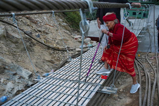 NUWAKOT, NEPAL - OCTOBER 15: Local residents walk on the newly installed Bailey bridge connecting the border areas of Nuwakot and Rasuwa districts on October 15, 2026 in Nuwakot, Nepal. The bridge was installed to restore road connectivity after severe flooding destroyed existing bridges on August 26, 2026.  Copyright: xChinaxNewsxServicex 111674496682