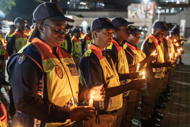 (261016) -- JOHANNESBURG, Oct. 16, 2026 -- Police officers attend a candlelight vigil calling for an end to gender-based violence and femicide (GBVF) in Johannesburg, South Africa, Oct. 15, 2026. The vigil follows widespread national outrage after the discovery of 11 women s bodies across the city of Ekurhuleni, east of Johannesburg, since July. (Photo by Shiraaz Mohamed Xinhua) SOUTH AFRICA-JOHANNESBURG-FEMICIDE-CANDLELIGHT VIGIL ChenxWei 