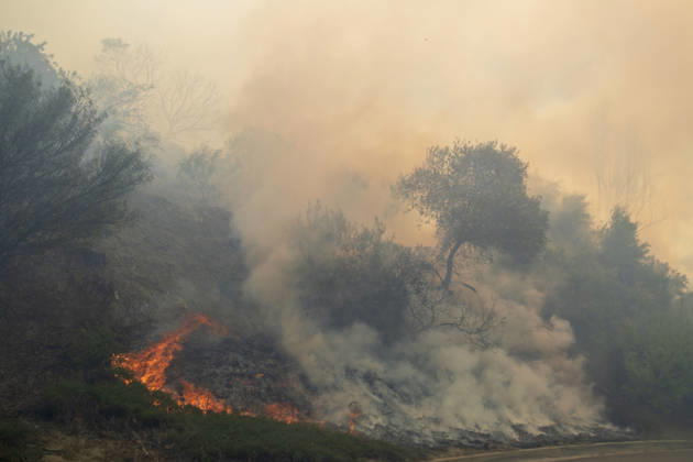 October16, 2026, San Juan Capistrano, California, USA: Fire crews are aggressively battling a wind-driven brush fire that burned several homes and threatened thousands of others in the area of San Juan Capistrano and San Clemente Friday, prompting evacuation orders. The Norte Fire exploded to 465 acres and remains 0 percent contained as of 4 p.m. O.C. Fire Authority officials said the Norte Fire started around 11:30 a.m. near Portico Del Norte and Eminencia Del Norte in San Clemente, east of Interstate 5. Fueled by strong Santa Ana winds, the wildfire then blew into neighboring San Juan Capistrano. San Juan Capistrano USA - ZUMAr19_ 20261016_new_r19_186 Copyright: xRuaridhxStewartx