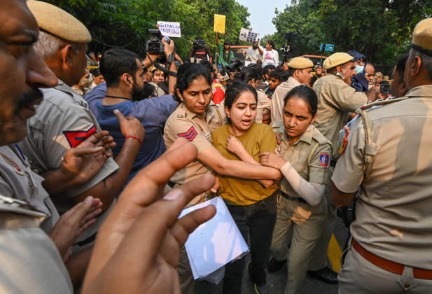 NEW DELHI, INDIA - OCTOBER 17: Delhi Police and paramilitary personnel detain members and workers of various organisations during a protest against Chief Election Commissioner Gyanesh Kumar and the Special Intensive Revision (SIR) of electoral rolls on Raisina Road on October 17, 2026 in New Delhi, India. (Photo by Raj K Raj Hindustan Times ) CJP Supporters Protest Demanding CEC Gyanesh Kumar s Resignation Over Voter List Changes