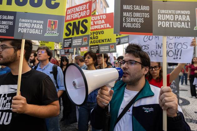 October 17, 2026, Porto, Portugal: Protesters hold placards during the National CGTP demonstration. Thousands of people joined the National General Confederation of the Portuguese Workers National Inter-Union (Confederacao Geral dos Trabalhadores Portugueses Intersindical Nacional) (CGTP) demonstration in Porto, marching from Praca da Batalha to Praca de D. Joao I, where they converged with participants of a housing rights protest. Porto Portugal - ZUMAs197 20261017_aaa_s197_295 Copyright: xDiogoxBaptistax