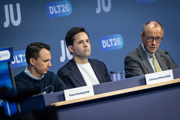 Pascal Reddig, Deputy National Chair of the JU; Johannes Winkel, National Chair of the JU; Friedrich Merz, Chancellor—from left to right—on stage after the Chancellor’s speech at Stage 78 of Germany Day 2026 in Bonn. Junge Union (JU), the youth organization of the CDU and CSU, Bonn, North Rhine-Westphalia, Germany World Conference Center Bonn