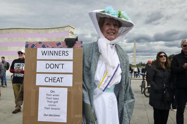 October 17, 2026, Washington Dc, Washington Dc, USA: Kathleen Breslin, 61, of Virginia dresses as a suffragette during a No Kings protest at the steps of the Lincoln Memorial in Washington DC, Oct. 17, 2026. The march, intended to encourage people to vote in the 2026 US midterm elections, was part of a 50-state get out the vote operation by the left-leaning Indivisible group. Protesters denounced the administration of US President Donald Trump and the Republican-led Congress for violating Constitutional and civil rights, federal and state laws, judicial orders and longstanding norms, casting Trump and the GOP as a threat to democracy. Washington Dc USA - ZUMAg216 20261017_znp_g216_020 Copyright: xDominicxGwinnx