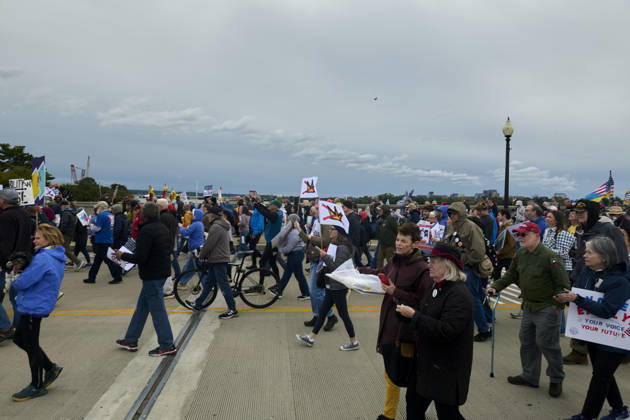October 17, 2026, Washington Dc, Washington Dc, USA: No Kings protesters march down the Arlington Memorial Bridge in Washington DC, Oct. 17, 2026. The march, intended to encourage people to vote in the 2026 US midterm elections, was part of a 50-state get out the vote operation by the left-leaning Indivisible group. Protesters denounced the administration of US President Donald Trump and the Republican-led Congress for violating Constitutional and civil rights, federal and state laws, judicial orders and longstanding norms, casting Trump and the GOP as a threat to democracy. Washington Dc USA - ZUMAg216 20261017_znp_g216_002 Copyright: xDominicxGwinnx