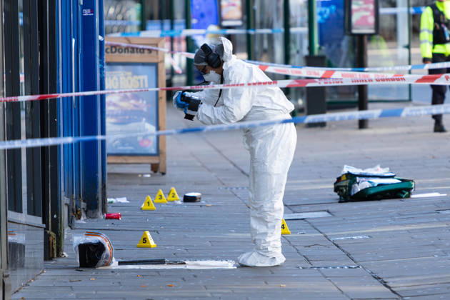 UK: Police Officer Shoooting Incident - Nottingham City Centre - 18th October 2026 A member of the forensics team photographs a weapon in a crime scene in Nottingham City Centre after a Police Officer was shot in the foot in the early hours of 18th October 2026 (Photo by Ben Booth EEm Sipa USA) Nottingham Nottingham City Centre Nottinghamshire England Copyright: xBenxBoothx