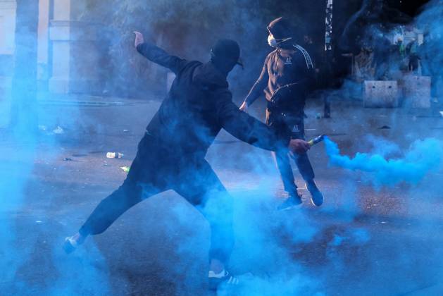 October 18, 2026, Tirana, Albania: Demonstrators clash with riot police in Skanderbeg Square as student-led anti-government protests continue for a sixth consecutive day. Confrontations spread from the Ministry of Education to central Tirana, with protesters throwing stones and pyrotechnics while police deploy tear gas and water cannons. Demonstrators demand improved university conditions and the resignation of Prime Minister Edi Rama. Tirana Albania  - ZUMAq101 20261018_zna_q101_215 Copyright: xVlasovxSulajx