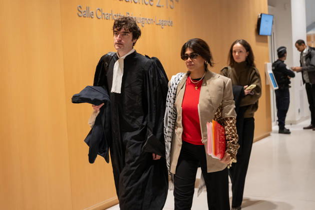 Rima Hassan Trial - Paris AJ www.alexisjumeau.comMEP Rima Hassan, wearing a keffiyeh draped over her shoulders (a symbol of the Palestinian people’s struggle), accompanied by her lawyer, Maitre Vincent Brengarth, walks towards the courtroom, Trial of Rima Hassan, MEP for the La France Insoumise (LFI) movement (a left-wing opposition political party), on charges of glorifying terrorism following a tweet featuring a photograph of Kozo Okamoto repeating a message about the need for armed struggle for the Palestinian cause and Palestine’s war with Israel, in the courtroom of the Paris Criminal Court, France on October 19, 2026. Photo by Alexis Jumeau ABACAPRESS.COM Paris France Copyright: xJumeauxAlexis ABACAx