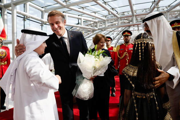 President Macron Visit To Kuwait French President Emmanuel Macron receives flowers, while The Emir of Kuwait Sheikh Mishal Al-Ahmad Al-Jaber Al-Sabah stands nearby, upon Macron s arrival at Kuwait International Airport in Kuwait City, Kuwait, October 19, 2026. Photo by Benoit Tessier Pool ABACAPRESS.COM Kuwait City Kuwait  Copyright: xTessierxBenoit Pool ABACAx