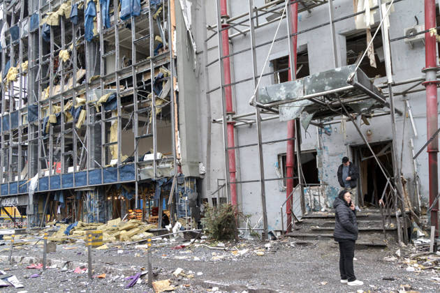 People stand outside a building in the Solomianskyi district damaged by a Russian attack, Kyiv, Ukraine, October 19, 2026. During the night and morning, Russia launched a massive strike on the capital using ballistic missiles, cruise missiles, and drones. According to Kyiv city head Vitali Klitschko, five people were injured in the Solomianskyi district as a result of the attack. Four residential buildings, a bank office, a private medical clinic, a shopping mall, offices, and vehicles were damaged. (Photo by Kyrylo Chubotin Ukrinform) Russian attack on Kyiv affects shopping mall Copyright: xKyryloxChubotinx