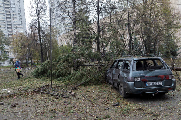 A spruce tree lies on a car in the Solomianskyi district damaged by a Russian attack, Kyiv, Ukraine, October 19, 2026. During the night and morning, Russia launched a massive strike on the capital using ballistic missiles, cruise missiles, and drones. According to Kyiv city head Vitali Klitschko, five people were injured in the Solomianskyi district as a result of the attack. Four residential buildings, a bank office, a private medical clinic, a shopping mall, offices, and vehicles were damaged. (Photo by Kyrylo Chubotin Ukrinform) Russian attack on Kyiv affects shopping mall Copyright: xKyryloxChubotinx