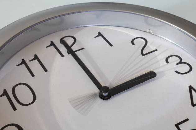 Illustrative image of the time change: a close-up of a clock taken with a long exposure, showing the second hand moving from 2 o clock to 3 o clock Copyright: xUdoxHerrmannx