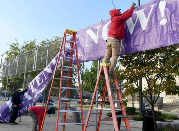 October 20, 2026, Racine, Wisconsin, USA: Workers put up a large banner announcing the start of voting as voters come to Racine City Hall Tuesday morning October 20, 2026 on the first day of early voting in Wisconsin for the midterm elections. There are two closely watched Congressional races, including the First District which includes Racine, and a contentious gubernatorial race on the ballot. Racine USA - ZUMAh154 20261020_znp_h154_005 Copyright: xMarkxHertzbergx