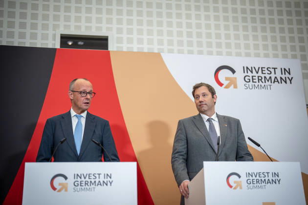 Chancellor Friedrich Merz with Federal Minister of Finance Lars Klingbeil (from left) during his closing remarks at the Invest in Germany Summit 2026 at the ESMT European School of Management and Technology in Berlin, Berlin, Germany; ESMT Berlin