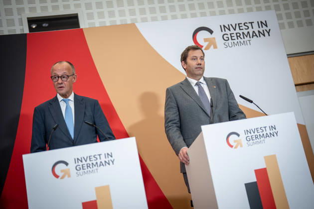 Chancellor Friedrich Merz with Federal Minister of Finance Lars Klingbeil (from left) during his closing remarks at the Invest in Germany Summit 2026 at the ESMT European School of Management and Technology in Berlin, Berlin, Germany; ESMT Berlin