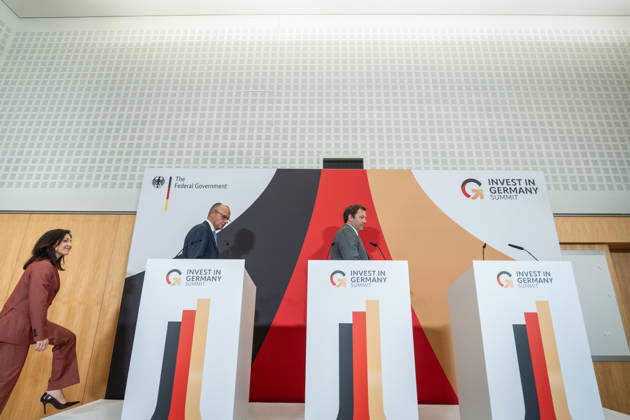 Katherina Reiche, Federal Minister of Economics; Friedrich Merz, Federal Chancellor; and Lars Klingbeil, Federal Minister of Finance (from left) during the closing remarks at the Invest in Germany Summit 2026 at the ESMT European School of Management and Technology in Berlin, Berlin, Germany; ESMT Berlin