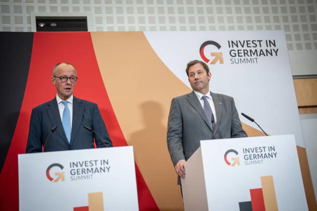 Chancellor Friedrich Merz with Federal Minister of Finance Lars Klingbeil (from left) during his closing remarks at the Invest in Germany Summit 2026 at the ESMT European School of Management and Technology in Berlin, Berlin, Germany; ESMT Berlin