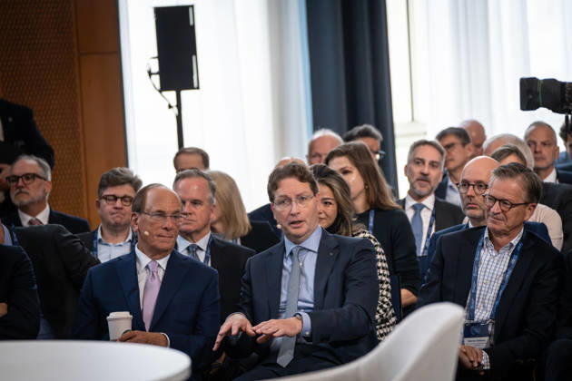 Larry Fink (Laurence Douglas Fink) with Starbucks Coffee’s Pappbecker in the front row at the Berlin Global Dialogue in the former State Council building of the GDR; seated to his right is Ola Källenius, CEO of Mercedes-Benz Group AG. Berlin Global Dialogue 2026 (BGD 2026), theme: Advancing Alliances for a New Era, Berlin, Berlin, Germany, ESMT
