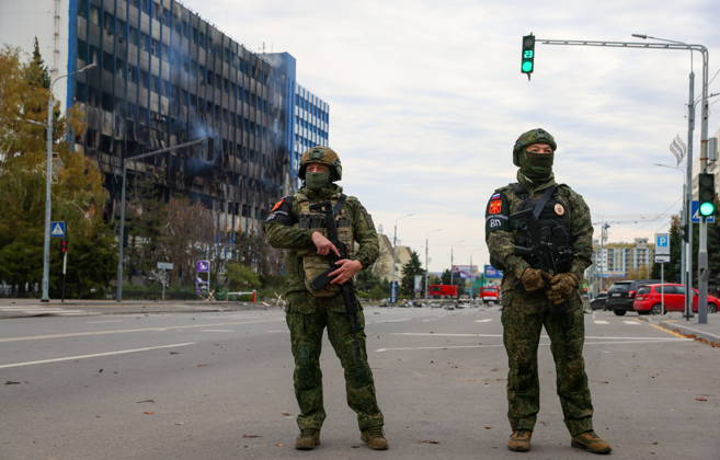 RUSSIA, LUGANSK - OCTOBER 21, 2026: Military police officers stand guard outside a communication hub damaged by a Ukrainian drone strike. Alexander Reka TASS  99700489