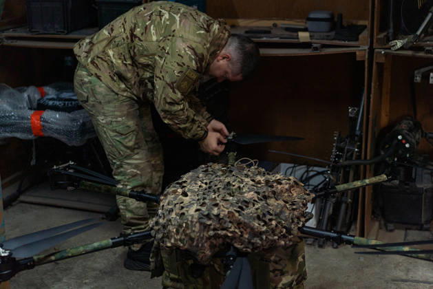 Ukrainian drone unit Skymonsters upgrades heavy UAVs in Kharkiv region KHARKIV REGION, UKRAINE - OCTOBER 21: Members of Skymonsters, the drone unit of the 13th Khartiia Brigade of Ukraine s National Guard, assemble, upgrade, and repair large unmanned aerial vehicles at an undisclosed location in Kharkiv region, Ukraine, on October 21, 2026. The drones, including Vampire models used for logistics missions and heavy bombers capable of carrying 13 to 20 kilograms of explosives, are prepared here before deployment to frontline positions. Carlo Bravo Anadolu Kharkiv Ukraine. Editorial use only. Please get in touch for any other usage.  Copyright: x2026xAnadoluxCarloxBravox