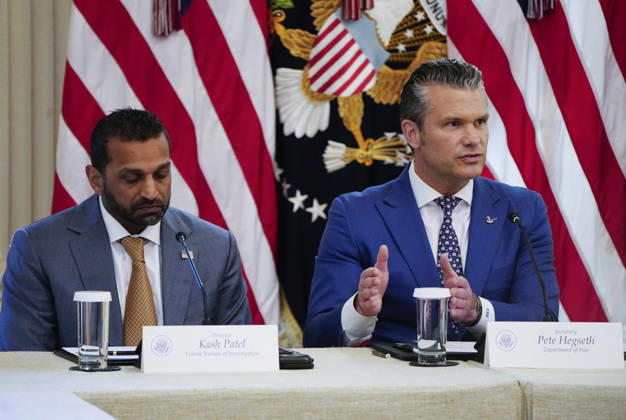 Defense Secretary ?Pete Hegseth speaks as FBI Director Kash Patel (L) listens during a roundtable discussion on cybercrime in the East Room of the White House in Washington, DC on Wednesday, October 21, 2026. The discussion focuses on combatting foreign-based organized crime targeting Americans online and federal seizures of fraudulent crypto and scam websites.  WAP20261021915 BONNIExCASH