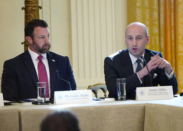 Deputy Chief of Staff Stephen Miller ??speaks as Homeland Security Secretary Markwayne Mullin (L) listens during a roundtable discussion on cybercrime in the East Room of the White House in Washington, DC on Wednesday, October 21, 2026. The discussion focuses on combatting foreign-based organized crime targeting Americans online and federal seizures of fraudulent crypto and scam websites.  WAP20261021920 BONNIExCASH