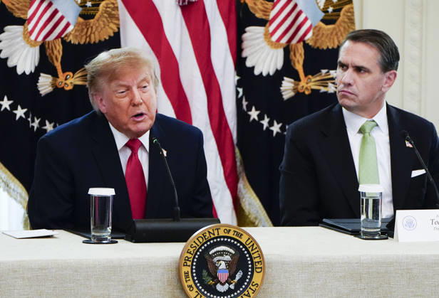 President Donald Trump speaks as Attorney General Todd Blanche (R) listens during a roundtable discussion on cybercrime in the East Room of the White House in Washington, DC on Wednesday, October 21, 2026. The discussion focuses on combatting foreign-based organized crime targeting Americans online and federal seizures of fraudulent crypto and scam websites.  WAP20261021924 BONNIExCASH