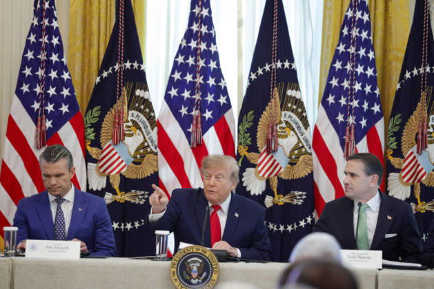 Secretary of Defense Pete Hegseth (L) and Attorney General Todd Blanche (R) listens as President Donald Trump speaks during a roundtable discussion on cybercrime in the East Room of the White House in Washington, DC on Wednesday, October 21, 2026. The administration is fighting back against foreign-based organized criminal organizations that exploit Americans in cyberspace and their scam centers and fraud schemes.  WASP20261021507 SamuelxCorum