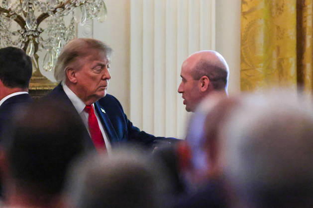 President Donald Trump and Stephen Miller speak during a roundtable discussion on cybercrime in the East Room of the White House on Wednesday, October 21, 2026 in Washington, DC. The administration is fighting back against foreign-based organized criminal organizations that exploit Americans in cyberspace and their scam centers and fraud schemes.  WAX20261021816 SamuelxCorum