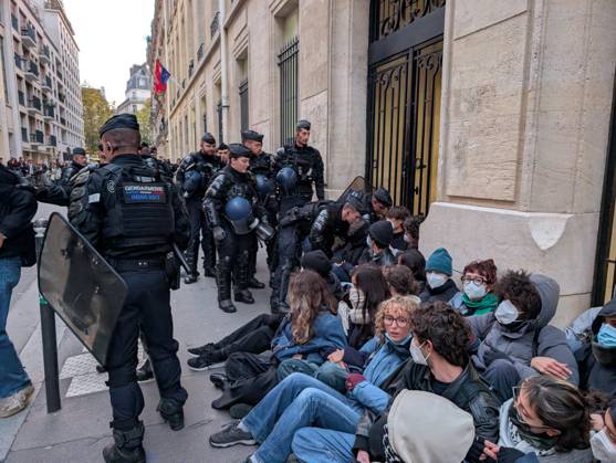 Students stage sit-in protest at Sciences Po Paris PARIS, FRANCE - OCTOBER 22: French gendarmerie officers intervene as students stage a sit-in protest outside Sciences Po Paris in Paris, France, on October 22, 2026. Students remain seated on the sidewalk as officers approach and attempt to remove protesters from the area. Luc Auffret Anadolu Paris France. Editorial use only. Please get in touch for any other usage.  Copyright: x2026xAnadoluxLucxAuffretx