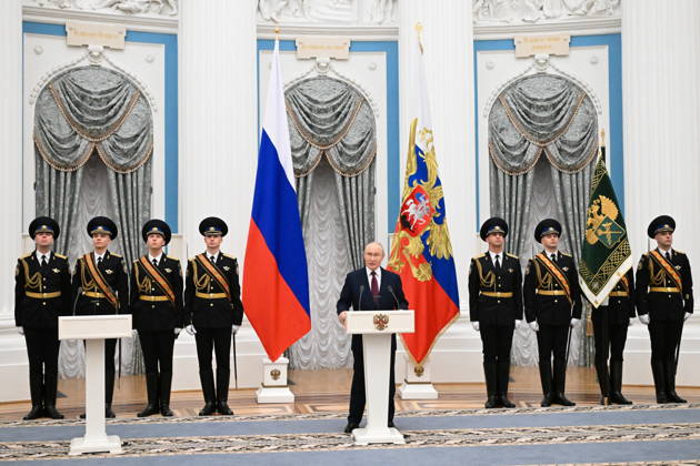 RUSSIA, MOSCOW - OCTOBER 22, 2026: Russia s President Vladimir Putin (C) speaks during a ceremony to present the banner of the Federal Customs Service of Russia to the agency s head Pikalev (not pictured). Approved by a presidential decree in 2019, the banner has not yet been presented to the agency s top official. Pelageya Tikhonova POOL TASS  99763322