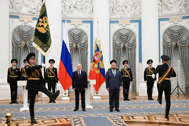 RUSSIA, MOSCOW - OCTOBER 22, 2026: Russia s President Vladimir Putin (CL midground) presents the banner of the Federal Customs Service of Russia to the agency s head Valery Pikalev (CR midground) during a ceremony at the Kremlin. Approved by a presidential decree in 2019, the banner has not yet been presented to the agency s top official. Pelageya Tikhonova POOL TASS  99765237