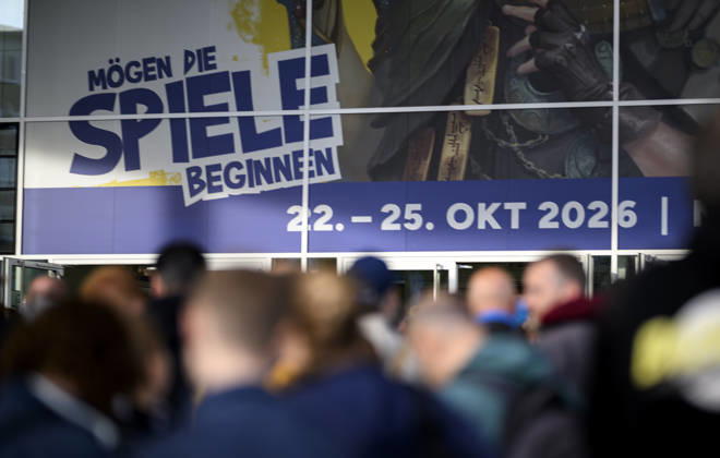 Visitors wait in front of the East Entrance; a rush of people; behind them, the SPIEL 26 logo; on October 22, 2026, at the SPIEL Essen trade show, held from October 22–25, 2026, in Essen, Germany, at the Grugahalle