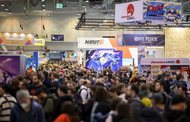 Visitors in the exhibition halls, Hall 5: Trading Card Games, One Piece, Naruto, Sushi Push, on October 22, 2026, at the SPIEL Essen trade show from October 22–25, 2026, in Essen, Germany, at the Grugahalle