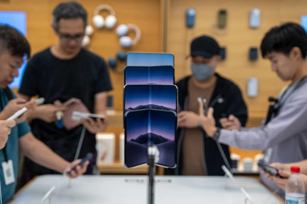 First Day on sale of IPhone Duo in Hong Kong iPhone DUO on display at an Apple Store on October 22, 2026 in Hong Kong. The iPhone DUO is Apple INC.™s first foldable phone, today is the first day the new iPhone DUO is available to the public. (Photo by Vernon Yuen Nexpher Images) HONG KONG HONG KONG