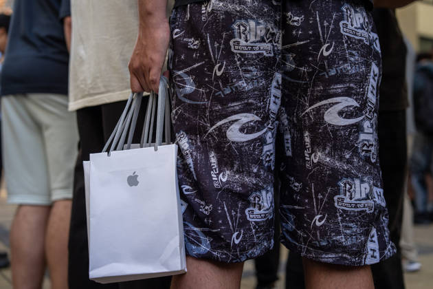 First Day on sale of IPhone Duo in Hong Kong iPhone resellers holding bags of iPhone Duo outside an Apple Store on October 22, 2026 in Hong Kong. The iPhone DUO is Apple INC.™s first foldable phone, today is the first day the new iPhone DUO is available to the public. (Photo by Vernon Yuen Nexpher Images) HONG KONG HONG KONG