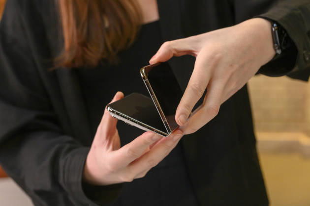 October 23, 2026, London, London, UK: London, UK. Customers inside the Apple Covent Garden store view and buy the new Apple iPhone Duo, the companyâ€⠢s first foldable iPhone. Opened, it is the thinnest iPhone ever, with a 7.6-inch inner display that provides a large canvas for viewing content, gaming, and multitasking, and a special nano-texture finish that minimises glare for an unparalleled viewing experience. Closed, the 5.4-inch outer display delivers 90 percent of the screen area of iPhone 18 Pro in a compact, pocketable design. London UK - ZUMAl94_ 20261023_zaf_l94_012 Copyright: xRayxTangx